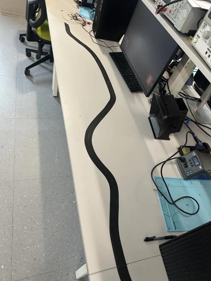The line-following test track taped out on the lab bench